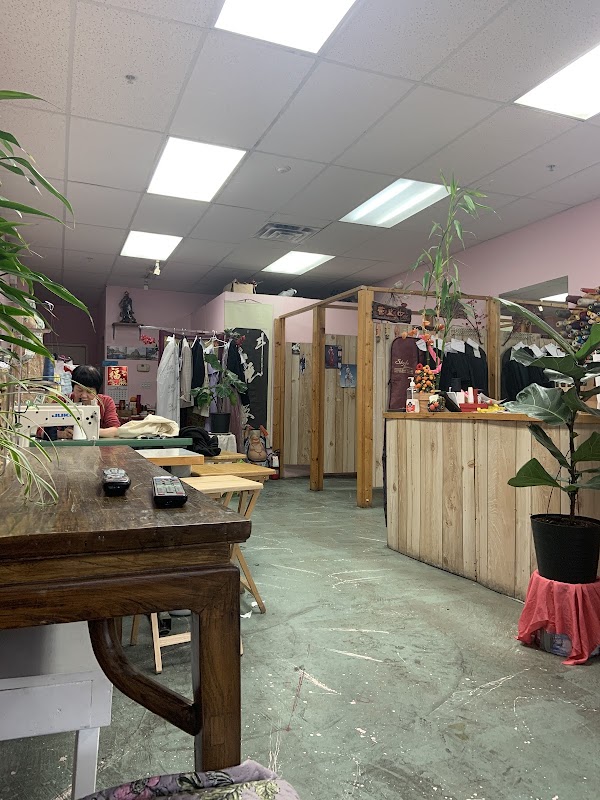 Inside the alterations shop with clothing racks